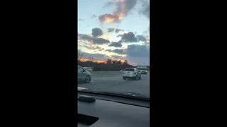 Man hangs on moving car after road rage incident