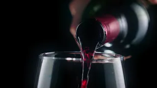 FREE VIDEO FOOTAGE NO COPYRIGHT Pouring red wine from a bottle, very close view