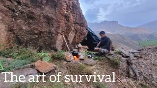 Building a rock shelter against rain in the mountains_ the art of survival in heavy rain_ cooking