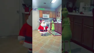 Santa and the grinch fighting