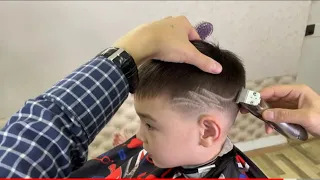 Детская стрижка с рисунком. Children's haircut with a pattern