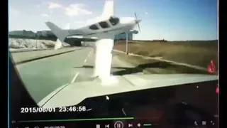 CAUGHT ON CAMERA: Dash-cam captures car's  near miss with plane