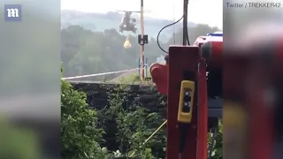 RAF Chinook drops 400 tonnes of sand onto crumbling dam to stop it collapsing and wiping out Peak