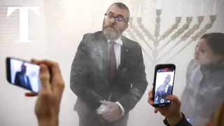 Polish MP thrown out of parliament after dousing Jewish menorah