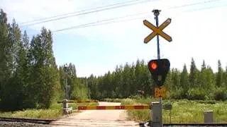 Finnish express train 911 passed Sauvamäki level crossing