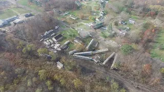 Aerial footage of crews working to put derailed train cars back on track in Ravenna