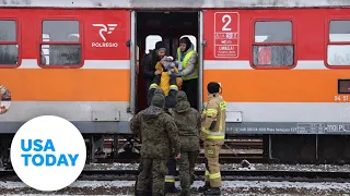 Ukraine: Video shows people arriving to Poland amid Russian invasion | USA TODAY