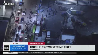Unruly crowd setting fires in Hollywood