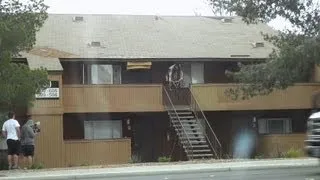 BMX pro Tyler Fernengel jumping off roof to rail with slo-mo