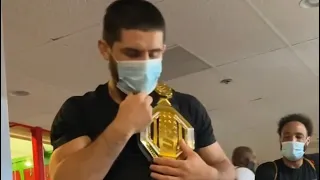 Islam makhachev gets mail belt gift from a fan.