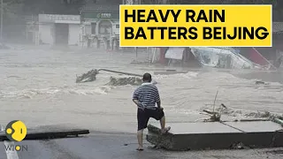 Heavy rain brings severe flooding to Beijing, killing at least 11 | WION Originals