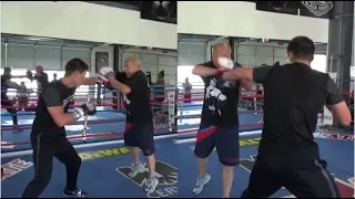 DMITRY BIVOL LIFTS HIS TRAINER OFF THE GROUND AS HE UNLOADS ON MITTS FOR AUGUST 4 HBO, WBA DEFENCE