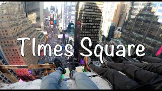 Climbing the ball drop building, in Times Square