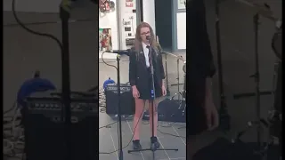 Shy girl sings in front of an audience for the first time