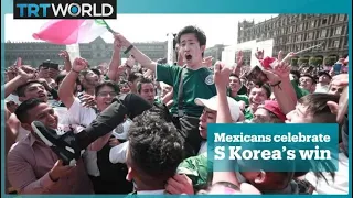 Mexico fans celebrate South Korea's win against Germany in the World Cup