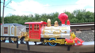 Trains for children video. Children's toy Train rides on real rails