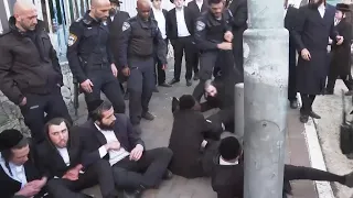 Israeli police remove ultra-Orthodox men from protest outside recruitment centre in Jerusalem