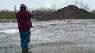 Target Practice With a 44 Magnum- Slow Motion Video
