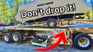 How to get a pontoon boat off a flatbed trailer!