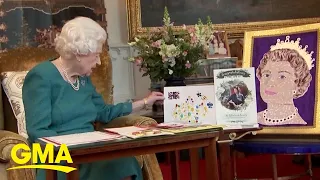 Queen Elizabeth II admires items from the Royal Archives ahead of Platinum Jubilee