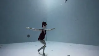 Stable Diffusion experiment AI text2video - Julie Gautier underwater dance as an action toy doll