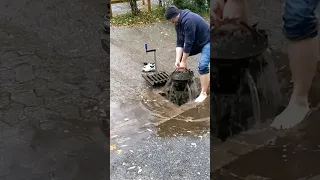 S#009 Unclogging a storm drain after rain on a gravel car park in Germany, #shorts