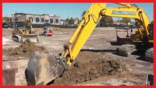 Excavator Digging Trench and Installing Trench Box Komatsu PC 490