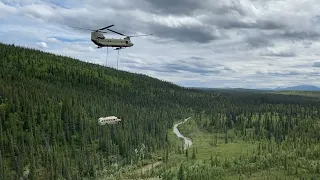 Abandoned bus famous from film 'Into The Wild' airlifted from Alaska's wilderness over safety fears