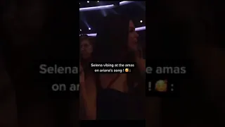 Selena vibing to Ariana