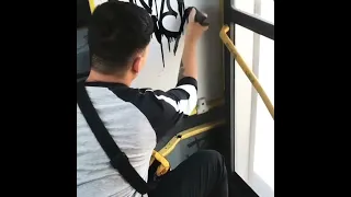 Graffiti tag on a bus