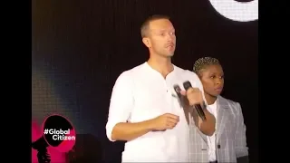 Chris Martin calming the crowd after a fallen barrier