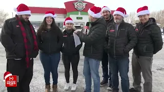 Young man surprised at pizza restaurant with gift from Secret Santa graduates from high school!