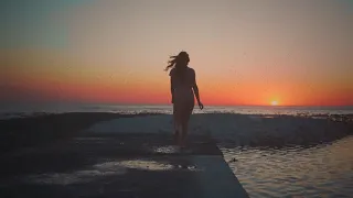 Silhouette of Girl walking in sunset