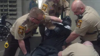 Ramsey County sheriff's correctional officer uses force on a restrained inmate