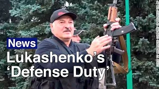 Belarus’ Lukashenko Brandishes Rifle During Mass Opposition Rally | The Moscow Times