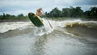 Stand up paddle surfing on Amazon River tidal bore