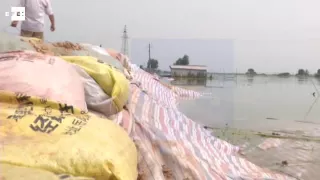 Explotan un dique para dispersar agua de inundaciones en China