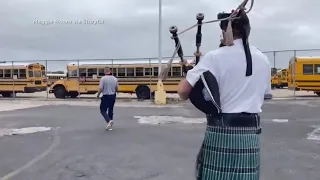 Bagpiper follows principal for senior prank