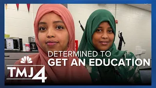 Two sisters who were forbidden to go to school have now graduated high school