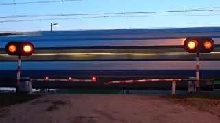 7 Trains at unique relay-controlled railroad crossing on polish HSR line