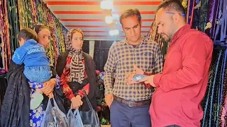 Buying clothes in the traditional market: a beautiful day with Qasim family