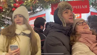 Happy Russians meet new year and Christmas songs and dancing. Snow winter 2024