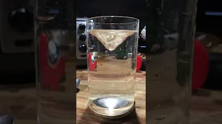 Whirlpool experiment in glass cylinder