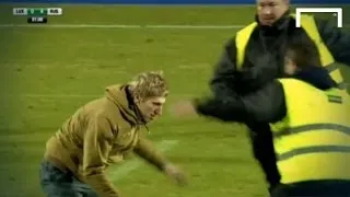 FUNNY! Pitch invader dribbles past two stewards