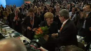 Merkel overwhelmingly re-elected head of conservative party