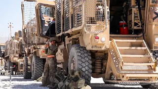 U.S. Military get ready to start a convoy during drivers training with MRAP vehicles