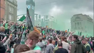 Celtic fans set off flares and sing on the streets of Glasgow