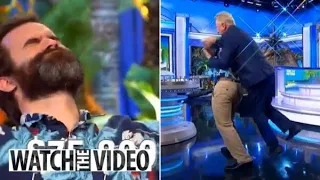 Wheel of Fortune host Pat Sajak tackles contestant on-stage in shocking moment at the end of wild