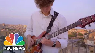 Guitarist Serenades Rome Under Coronavirus Lockdown From Capitol Terrace | NBC News