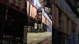 Stacking pallets in the air  on a reach truck Forklift